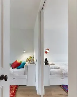 Single architrave free pocket door sliding into wall