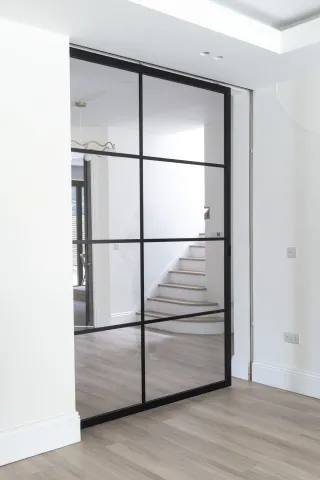 Metal frame pocket door